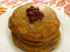 stack of pancakes with pecans on top