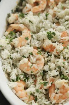 rice with shrimp and parsley in a white bowl