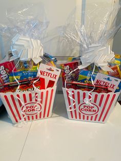 two bags of popcorn sitting on top of a counter