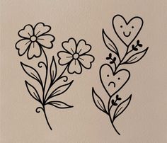 three flowers with hearts and leaves drawn on them