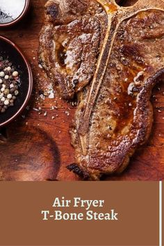 air fryer t - bone steak on a cutting board with spices and seasonings