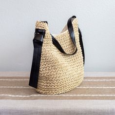 New style! Straw woven shoulder bag perfect for all occasions. This bag provides a unique combination of style, convenience, and durability. It's an ideal choice for days out, special events, and everyday wear. Magnetic button closure. Fully lined with inner pocket. Dimensions: 11"H x 14"W x 6"D 10" handle drop Designer Style ID: 8456 Eco-friendly Bucket Bag With Braided Handles, Versatile Everyday Bucket Straw Bag, Versatile Straw Shoulder Bag With Adjustable Strap, Versatile Bucket Straw Bag For Everyday Use, Trendy Handwoven Straw Shoulder Bag, Trendy Handwoven Bucket Bag, Eco-friendly Crochet Shoulder Bag With Woven Leather, Spring Natural Woven Hobo Bag, Everyday Bucket Straw Bag With Adjustable Strap