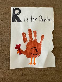 a child's handprint is shown on a piece of paper with the words r is for rooster