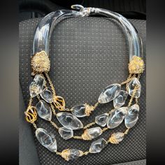 Alexis Bittar Clear Lucite Jeweled 4 Strands Necklace In Gold Tone Setting. Comes In Alexis Bittar Pouch. 12 " Inch Drop Of Thick 1" Inch Ice Like Lucite. Gold Jeweled Ends, Horned Thick Topper, Gold Toned Chains With Multi Strands Of Dangles With Articulated Hand Carved 1-2 " Inch Amazing Lucite Nuggets And Gemstone Studded Gold Toned Ornamentals. Gold Tone Alexis Bittar Font Logo Tag. This Is A Very Rare Collectible Alex Bittar Necklace. Great Like New Condition. Articulated Hand, Alexis Bittar Jewelry, Font Logo, Gemstone Studs, Alexis Bittar, Logo Tag, Multi Strand Necklace, Strand Necklace, Multi Strand