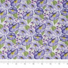 purple flowers on white background with green leaves and yellow centers, in the center is a ruler