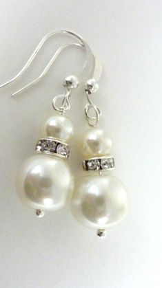 "Bridesmaids earrings ivory white pearl earrings silver rhinestone and ivory dangle drops Lovely white glass pearls are attached to silver rhinestone spacers and small 4mm ivory white pearls, and hang from silver fish hooks. You can also buy the matching necklace at https://www.etsy.com/listing/98611603/flower-necklace-vintage-necklace-white as shown in the second last photo. If you need more than the quantity stated, please feel free to contact me. These earrings measure a bit shorter than 2\" Bridesmaids Earrings, White Pearl Earrings, Ivory Earrings, White Pearl Earring, Fish Hooks, Silver Fish, Necklace White, Silver Rhinestone, Necklace Vintage