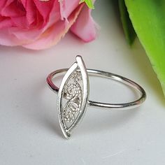 Filigree ring made by intricate metal work, creating a rich floral and dainty look. The sterling silver leaf ring is inspired by Art nouveau jewelry combined with modern design. This oval art ring is perfect for a beloved woman, and as a pampering gift for yourself. The ring is very flattering to the finger, comfortable to wear as a jewel for everyday use and impressive as a jewel for a special occasion. The structure of the ring is  approximately 12 mm long, creating an elegant and unique style. The ring is made of 925 sterling silver by hand tools only. Each piece of jewelry is handmade to order, therefor due to the special nature of handcrafting, there may be slight differences compared to the jewelry in the photos shown. This adds to the charm and individuality of each piece, making it Elegant Oval Sterling Silver Midi Rings, Elegant Oval Midi Rings In Sterling Silver, Delicate Oval Sterling Silver Rings, Dainty Silver Engraved Oval Ring, Sterling Silver Filigree Toe Ring, Adjustable Sterling Silver Oval Filigree Ring, Adjustable Oval Sterling Silver Filigree Ring, Filigrana Jewelry, Silver Oval Ring