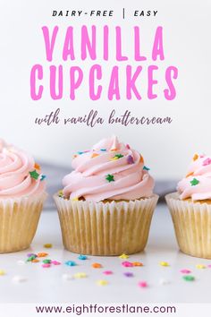 three vanilla cupcakes with vanilla buttercream frosting