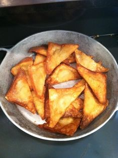 some food is sitting in a pan on the stove and ready to be cooked for consumption