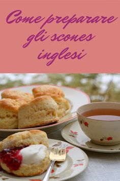 some scones with cream and jam on them are sitting on plates next to a cup of tea