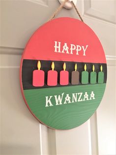 a happy kwanza sign hanging on the door