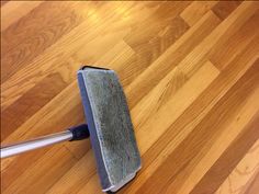 a mop is laying on the wooden floor