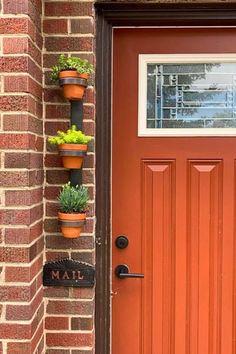 a red door with three planters on it