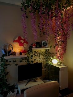 a living room with flowers hanging from the ceiling