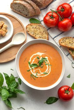 A bowl of creamy tomato bisque garnished with fresh basil and a swirl of cream, surrounded by fresh tomatoes, bread, and basil leaves. Creamy Tomato Bisque, Instant Pot Lasagna Soup, Instant Pot Lasagna, Tomato Bisque Soup, Bisque Soup, Vegetarian Comfort Food, Pot Lasagna, Tomato Bisque