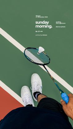 a man holding a tennis racquet on top of a tennis court