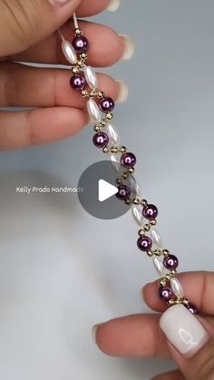 someone is making a beaded bracelet with pearls