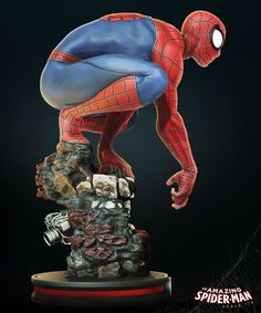 the amazing spider - man statue is on display