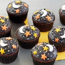 cupcakes decorated with stars and moon decorations