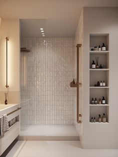 a white tiled bathroom with shelving on the wall