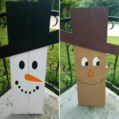 two cardboard snowmen with hats on each one