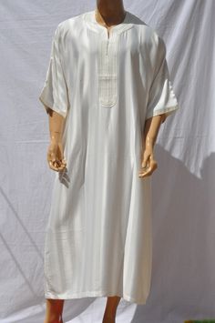 Moroccan kAFTAN for men, oriental kaftan, All sizes are Available Beautiful Moroccan kaftan in cotton for men. This Moroccan clothing is handmade in soft fabric cotton. This kaftan is very pleasant to wear mainly in summer, at the beach, after a spa, indoor, outdoor, at a party... Very fast to wear, not stick to the skin, this kaftan is a really must have clothing. - Cotton - embroidery - Machine washing return policy I check myself each product and sell only the best quality products in any cas Traditional Long Thobe With Dabka, Traditional Long Thobe With Dabka Details, Traditional Long Kaftan For Eid, Traditional Long Thobe For Ceremonial Occasions, Traditional Short Sleeve Kaftan For Ceremonies, Traditional Short Sleeve Kaftan, White Dabka Kaftan For Festivals, Traditional Long Ceremonial Thobe, Ceremonial Festive Long Thobe