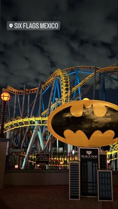 the batman coaster at six flags mexicano is lit up with yellow and blue lights