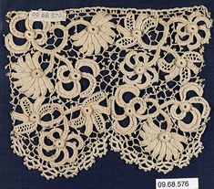 an image of a piece of lace with flowers on it