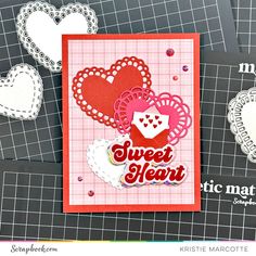 a close up of a card with hearts