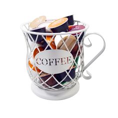 a white coffee cup filled with lots of different types of confection in it