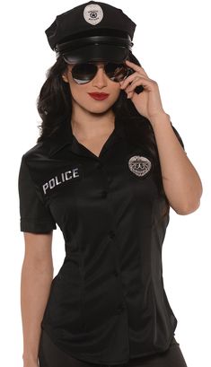 a woman in a police uniform is talking on her cell phone