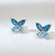 A PAIR OF EARRINGS  Perfect Gift: Whether you're treating yourself or surprising a loved one, these butterfly earrings make for a thoughtful and elegant gift. Packaged with care, they arrive ready for gifting. ✨ Elevate your style and embrace the spirit of December with our exquisite Natural London Blue and Swiss Blue Topaz Butterfly Earrings. 🦋💙 Gemstones: We use genuine London Blue Topaz and Swiss Blue Topaz, each showcasing its distinct and vibrant color. London Blue Topaz offers a deep, rich blue reminiscent of the evening sky, while Swiss Blue Topaz boasts a vivid and refreshing blue hue. Butterfly Design: Our earrings are artfully designed in the shape of delicate butterflies, symbolizing transformation, joy, and the beauty of nature. The intricate details and craftsmanship make th Cubic Zirconia Butterfly Charm Earrings For Gift, Blue Butterfly Charm Earrings For Gift, Blue Butterfly Earrings As Gift, Blue Butterfly Earrings Gift, Blue Butterfly Earrings For Gift, Blue Hypoallergenic Earrings For Mother's Day, Butterfly Earring, Butterfly Earrings Stud, Blue Topaz Earrings