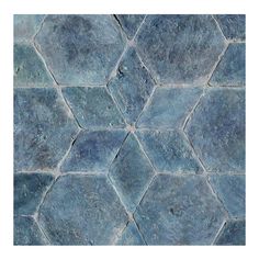 a blue tile floor with hexagonal shapes