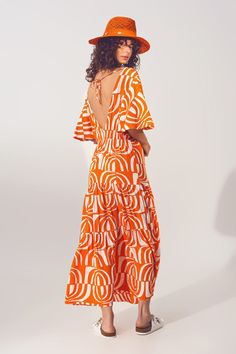 Introducing the perfect addition to your boho wardrobe - the V Neck Midi Dress with Print in Orange. This dress comes in midi or maxi length depending on your height and features an abstract print that will make you stand out. The dress has a V-neck neckline, angel sleeves, and a relaxed fit, which makes it perfect for any casual occasion.The dress also has a wrap front with adjustable back strap, tie back fastenings, and elastic waist to provide you with a comfortable fit. Made from 100% viscos White Boho Print V-neck Maxi Dress, Orange V-neck Midi Dress For Vacation, Summer V-neck Dress With Abstract Print, Bohemian V-neck Midi Dress With Vibrant Print, White V-neck Dresses With Vibrant Print, V-neck Beach Dress With Abstract Print, White Abstract Print Maxi Dress For Summer, V-neck Dress With Abstract Print For Vacation, Printed V-neck Sundress Midi Dress