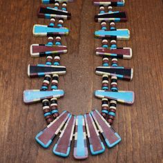 "Large Kewa necklace David Aguilar style work. We have purchased many items from David. This piece is not marked but is the style he does. The stones used are pipestone, jet, turquoise lepidolite, and serpentine. The stones are made into mosaic tabs or pendants. Each is 2\" long. The necklace is 32\" long. It is finished with a hook clasp. The necklace is in good condition. Thank  you for shopping in our store. Please let us know if you have questions.  NECK-1607K-NK-12 k *The color you see on your screen may not reflect the actual stone color due to variations in monitors*" Traditional Multicolor Necklace With Inlay, Multicolor Inlay Southwestern Necklace, One Of A Kind Multicolor Southwestern Necklace, Unique Multicolor Inlay Necklaces, Unique Multicolor Inlay Necklace, Tab Necklace, Shepherds Hook, Tucson Az, Heishi Beads