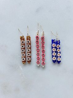 Each handmade pair is unique. Measures: 1: .25" W x 1.5" L 2: .25" W x 2" L 3: .25" W x 1.5" L Materials: Glass miyuki seed beads - 18k gold plated French hooks Seed Bead Charm Patterns, Seed Bead Earrings Ideas, Beaded Ideas, Beadwork Jewelry, Cute Friendship Bracelets, Beaded Things, Glass Lampwork, Seed Beading, Beaded Jewlery