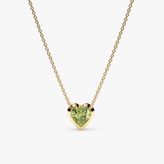 This captivating Peridot Heart Necklace adds a touch of vibrant green elegance to any outfit. The necklace features a delicate solid gold chain (available in yellow, rose, or white gold) and a sparkling heart-shaped peridot gemstone, set in a protective and stylish solid gold bezel setting. - Handmade - Solid Gold - Natural Peridot - Heart Size: 7.5 mm - Total Peridot Carat Weight: 0.60 ctw 🛠 Your Sarah Elise piece is handcrafted with care! Ready-to-ship items go out within 3 business days. Made-to-order pieces typically take 7-10 business days to create. If you need something sooner, please contact us - we'll see if we can make it happen! For estimated shipping dates and tracking, check your Etsy account under 'Orders'. 🚐Orders under $100 are sent with USPS First Class Mail tracking; or Elegant Green Heart Necklace For Valentine's Day, Elegant Green Heart Necklace For Gift, Elegant Green Heart Pendant Necklace, Green Heart-shaped Anniversary Necklace, Green Heart-shaped Gemstone Necklace, Green Necklace With Heart Charm For Anniversary, Green Heart Pendant Necklace With Birthstone, Green Heart Charm Necklace For Anniversary, Memory Ring