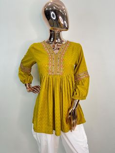 Yellow and Pink Embroidered Cotton Blend  A-line Tunic Top /Kurti For Women Short Kurta For Women- This outfit is made with the finest Cotton of India. The set contains : 1  Kurti Kurti:   The yellow and pink embroidered A-line top kurti/tunic comes with a v neck ,flared hem and pleated details.  Sleeve length :  3/4 Sleeves   Material : Kurti : Cotton Blend Fabric Care : Machine wash Front length : 32 inches Please see the photo section  to choose a perfect size for yourself.  *Please note the Long Sleeve Yellow Kurta For Summer, Yellow Long Sleeve Summer Kurta, Casual Long Sleeve Yellow Kurta, Fitted Yellow Bohemian Kurta, Yellow Short Kurti, Indian Tunic, Embroidered Kurti, Kurta Dress, Yellow Dress