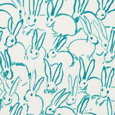 blue and white drawing of many rabbits on a white background with green ink in the middle