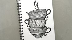 a drawing of two coffee cups on top of each other