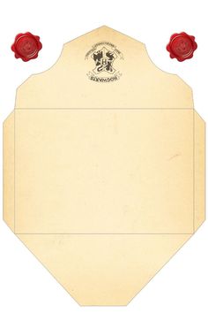 a piece of paper with two red roses on it and an envelope in the middle