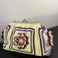 ✈️✈️✈️  READY TO SHIP  ✈️✈️✈️ Discover the charm of our Handmade Retro Style Bag, a unique blend of vintage elegance and modern boho chic flair. This stunning bag features a classic kiss lock clasp, reminiscent of old Hollywood glamour, paired with meticulously crafted granny square patterns. Versatile in design, it can be used as a shoulder bag, crossbody bag, or handle bag, making it perfect for everyday use. This handcrafted bag is an ideal gift for her, showcasing the beauty of traditional crochet techniques and detailed artistry. The lotus motif adds a touch of purity and sophistication, making this bag not only a functional accessory but also a statement piece. 📍100% Handmade 📍Size of Bag: 35x25x11 cm.  📍Lenght of Chain Strap: 100 cm. 📍Linned + Crochet pocket inside 📍Free Shippi Crochet Kiss Lock Bag, Vintage Cream Crochet Handmade Bag, Vintage Handmade Square Crochet Bag, Multicolor Handmade Vintage Crochet Bag, Elegant Leather Crochet Bag, Rectangular Shape, Lotus Motif, Granny Square Patterns, Modern Boho Chic, Crochet Metal