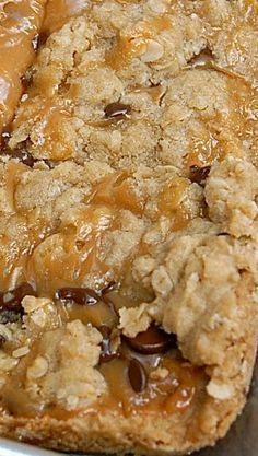 a close up of food on a pan with some sauce in the middle and other toppings