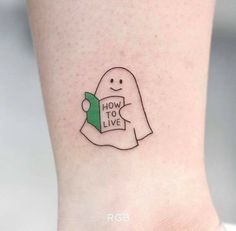 a small ghost with a book in its hand and how to live written on it