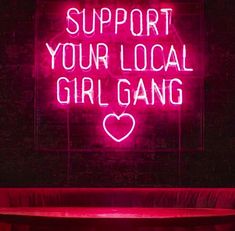 a neon sign that says support your local girl gang