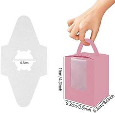 a person holding a pink bag with the measurements for it and an image of their hand