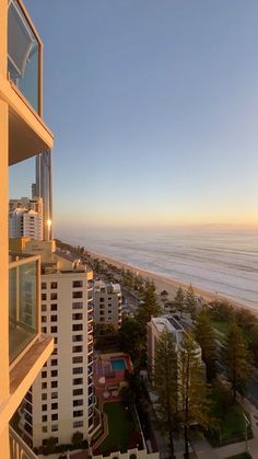 an apartment building overlooks the beach and ocean in surfer's paradise, australia