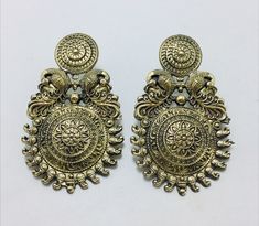 This pair of magnificent golden-hued Tribal earrings is adored by a big audience all around the world since they are made of the highest quality material. This enticing set of tribal earrings is one of the magnificent tribal jewelry pieces in our collection. Add elegance and charisma to your beautiful personality with these finely designed tribal earrings created by our artisans. Hardworking people meticulously construct these gorgeous tribal artefacts to perfection. Weddings, engagements, famil Beautiful Personality, Kuchi Jewelry, Vintage Inspired Earrings, Boho Cuff, Afghan Jewelry, Henna Tattoo Designs, Earrings Vintage, Earrings Dangle, Henna Tattoo