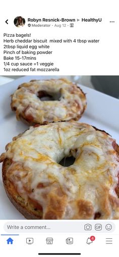 two donuts covered in cheese on a white plate