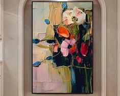 an abstract painting with flowers in a vase on a beige wall above a fireplace mantel